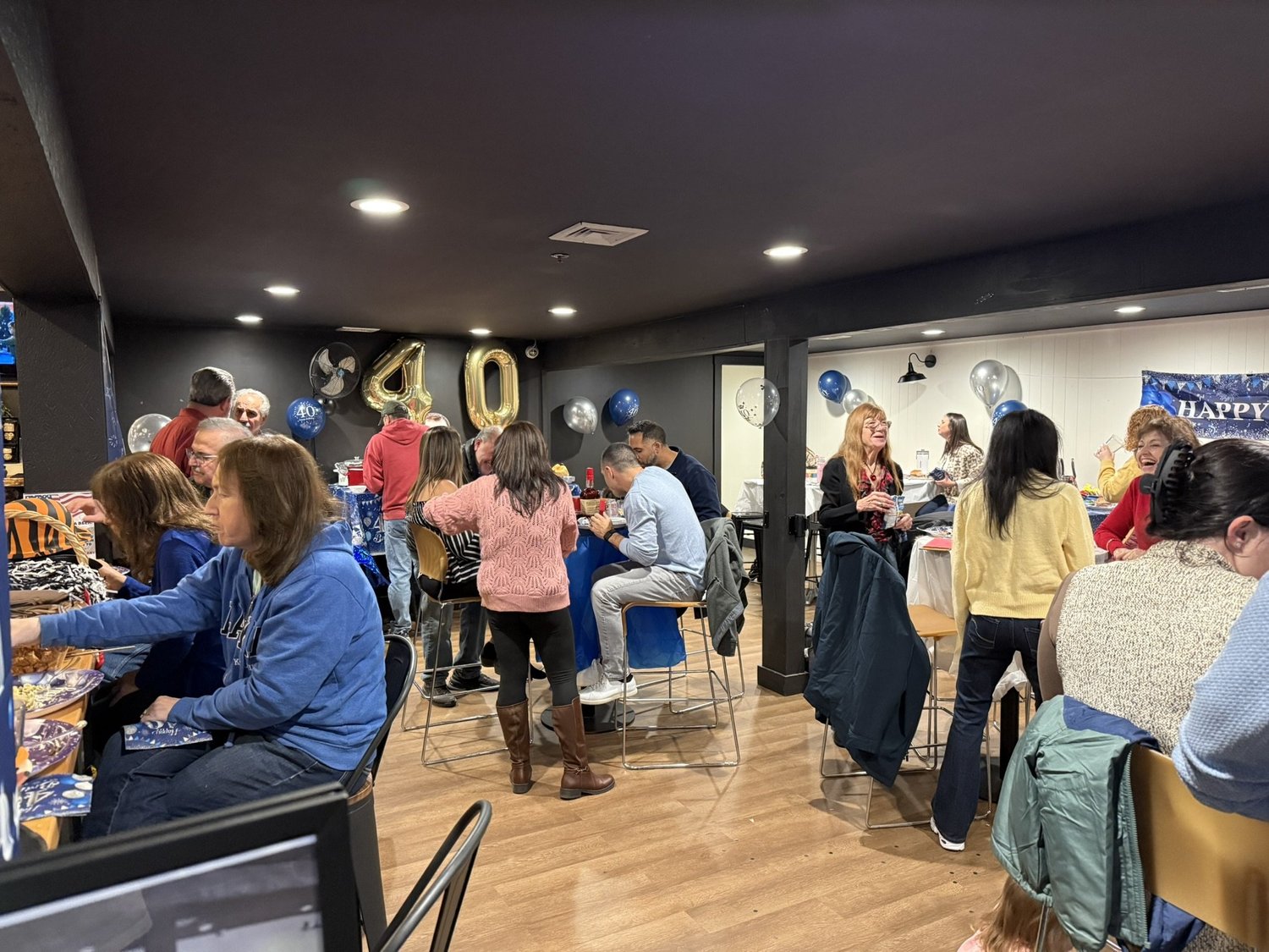 Guests celebrating a birthday together in the CraftRoots private event room